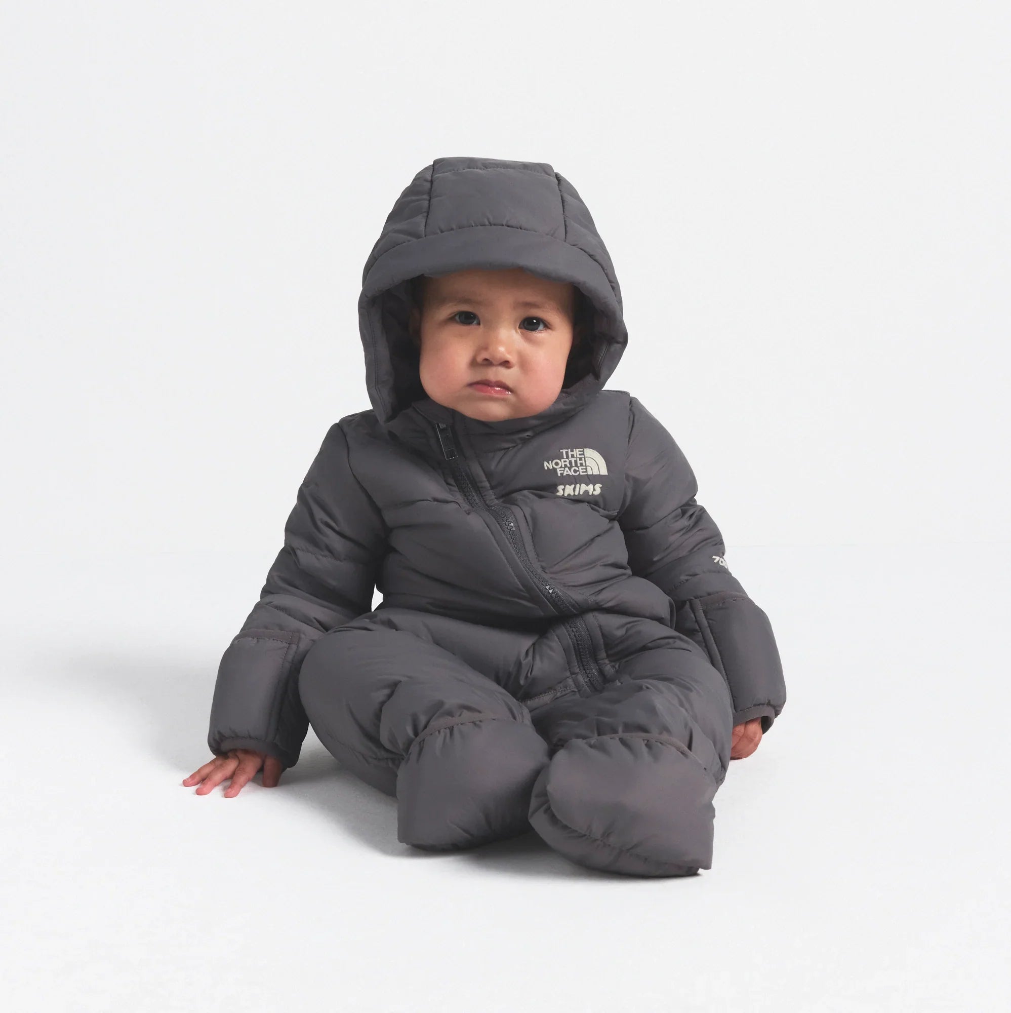 THE NORTH FACE X SKIMS BABY 1996 NUPTSE ONE-PIECE | GUNMETAL