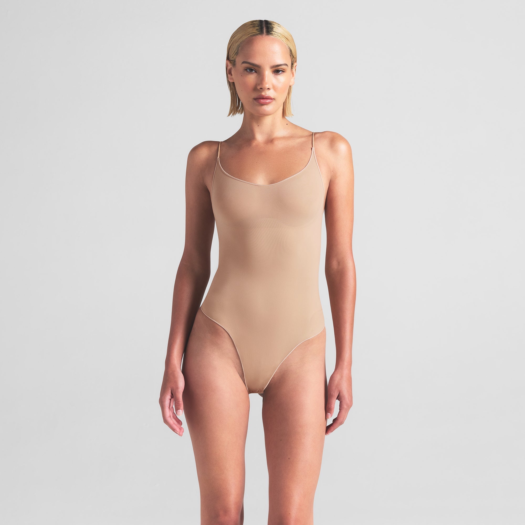 SKIMS SHEER SEAMLESS THONG BODYSUIT | CLAY