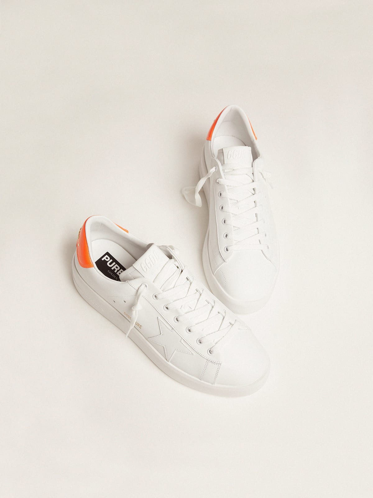 Golden Goose White Purestar sneakers with fluorescent orange heel tab