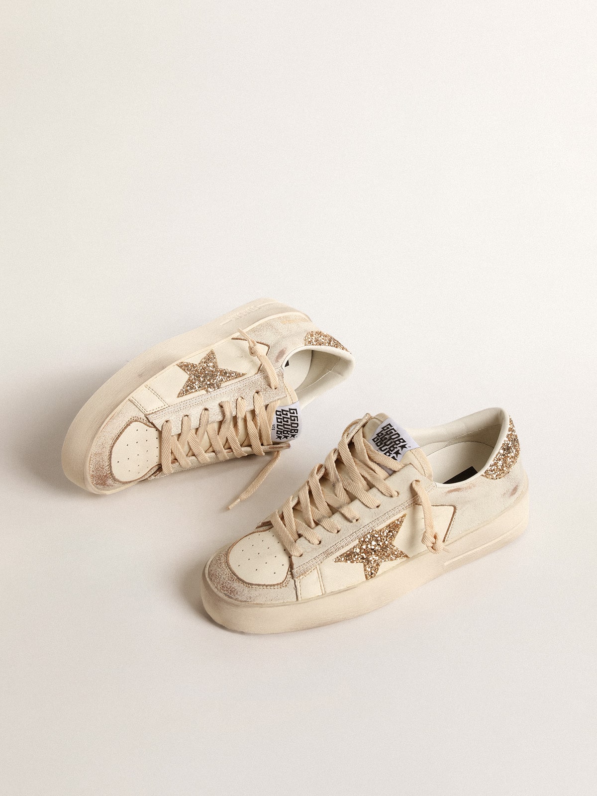 Golden Goose Women’s Stardan in ecru nappa leather with gold glitter star and heel tab