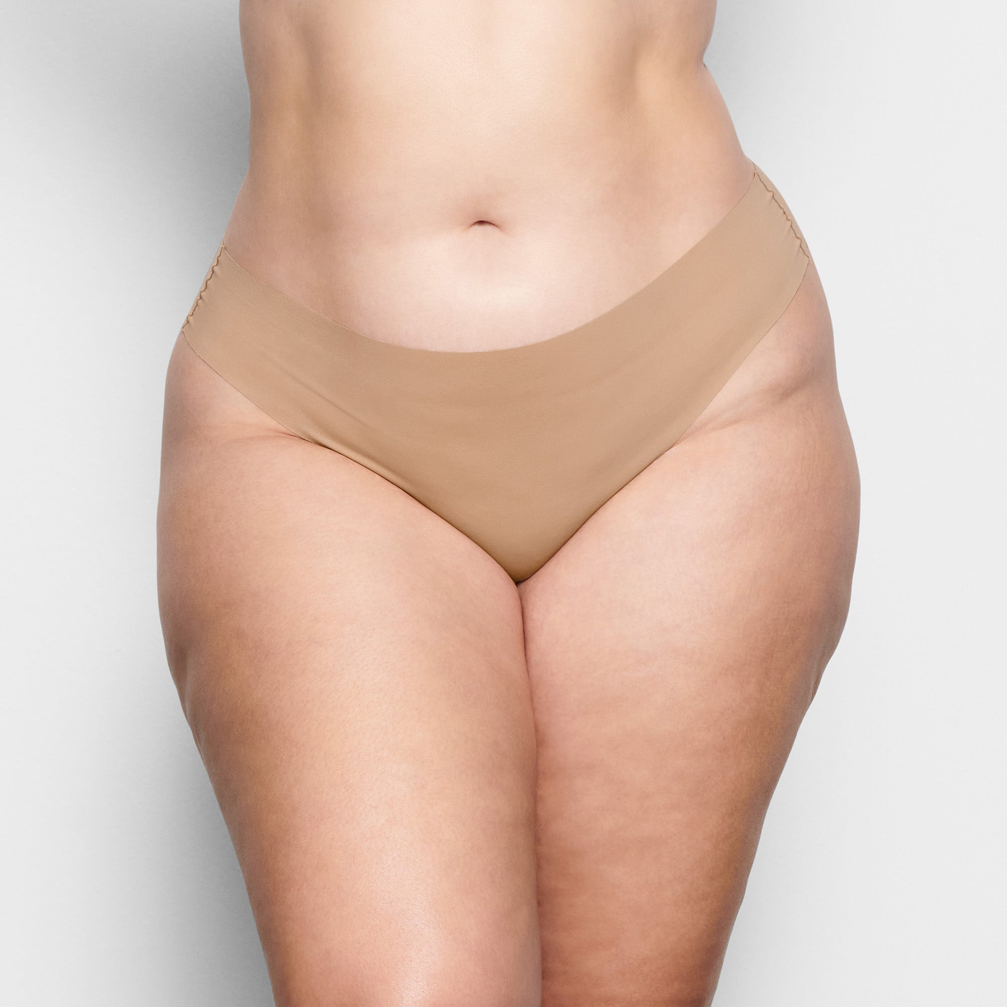 SKIMS NAKED DIPPED THONG | CLAY