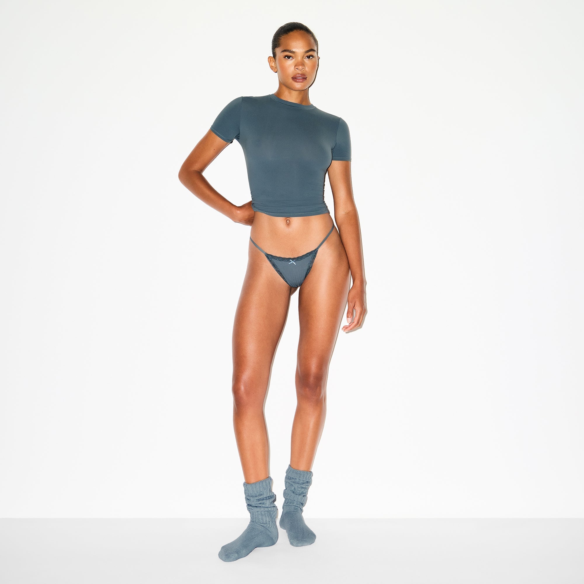 SKIMS LIGHTWEIGHT COTTON POINTELLE LACE STRING THONG | ZIRCON TONAL